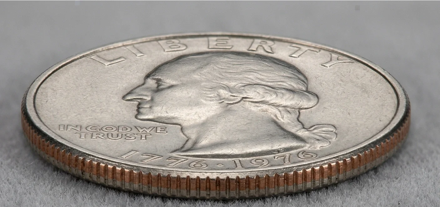 Macro shot of 1976 quarter edge and face, neutral tones, realism style